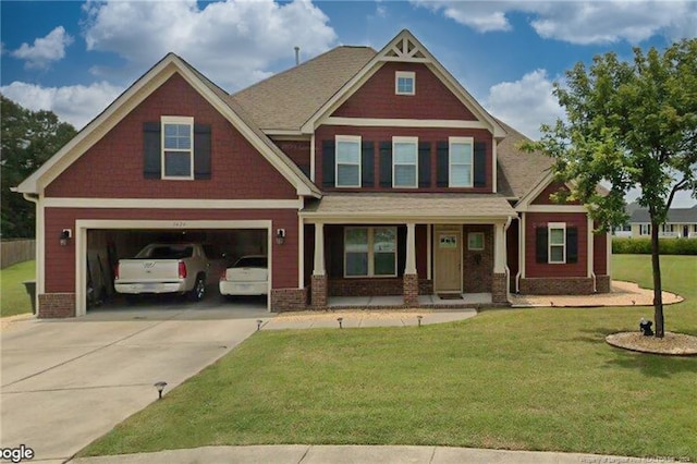 craftsman inspired home with a front yard and a garage