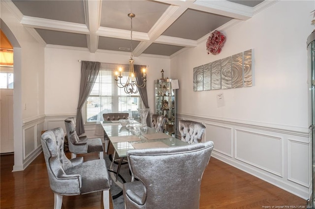 dining room featuring beamed ceiling, a chandelier, crown molding, and coffered ceiling