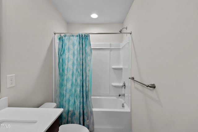 full bathroom with toilet, vanity, and shower / bath combo