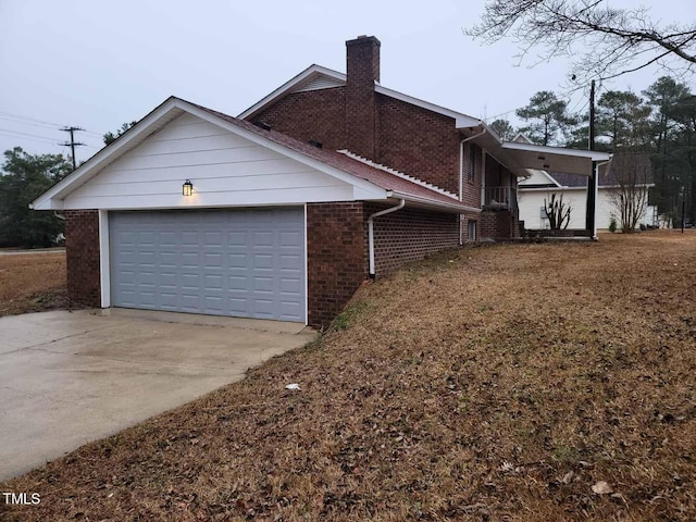 view of side of home featuring a garage