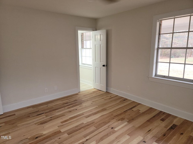spare room featuring light hardwood / wood-style floors