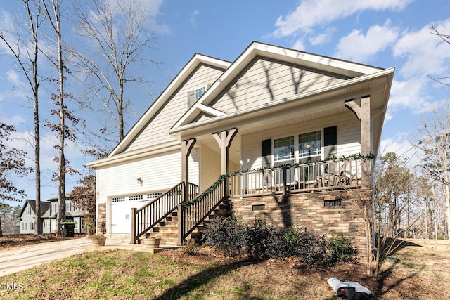 view of front of house featuring a porch and a garage