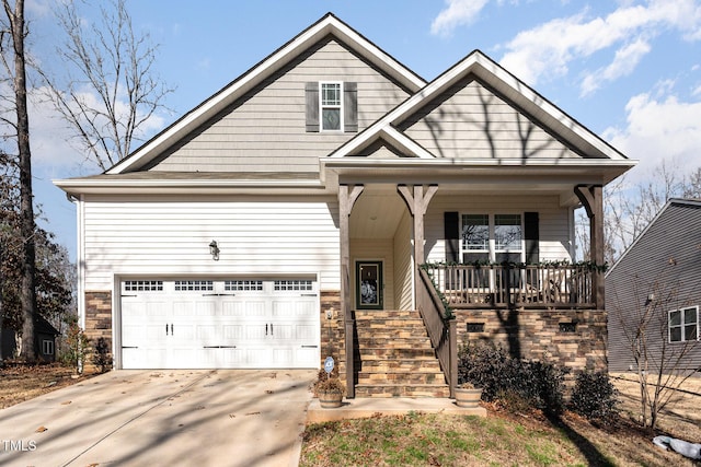 craftsman inspired home with a porch and a garage