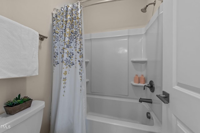 bathroom with shower / bath combo and toilet