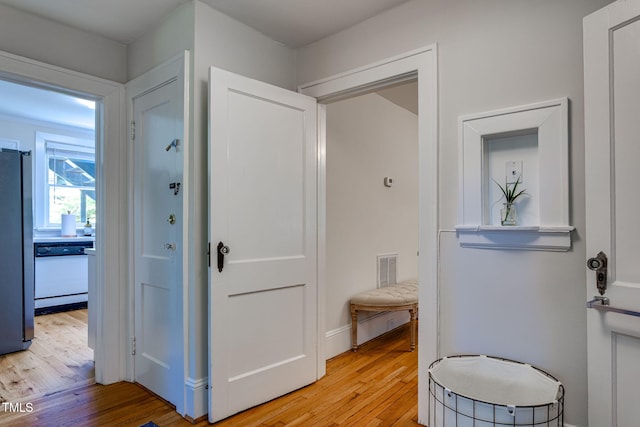 bathroom with hardwood / wood-style flooring