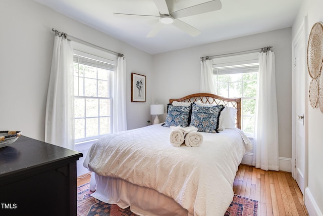 bedroom with hardwood / wood-style floors and ceiling fan