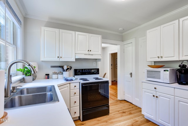 kitchen with white cabinets, light hardwood / wood-style floors, range with electric stovetop, and sink