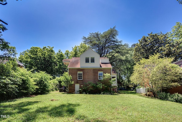 view of home's exterior featuring a lawn