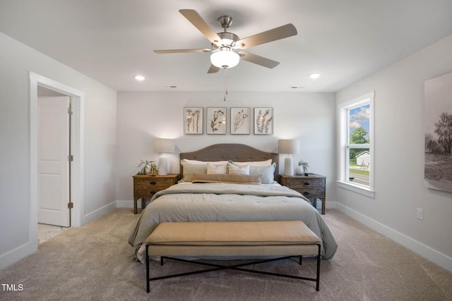 bedroom with a ceiling fan, recessed lighting, light colored carpet, and baseboards