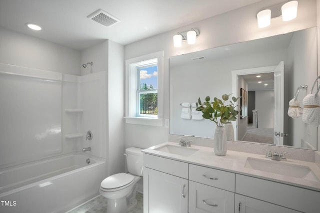 full bathroom featuring toilet, vanity, and washtub / shower combination