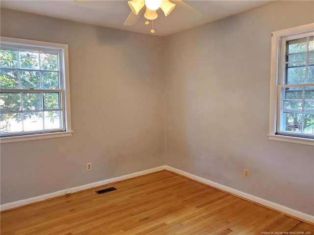 unfurnished room featuring ceiling fan and light wood-type flooring