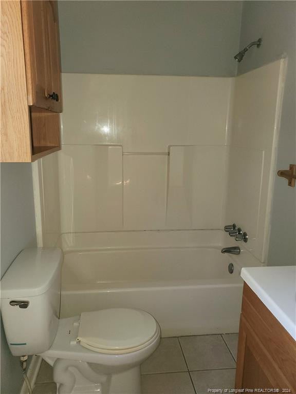 full bathroom featuring tile patterned flooring, vanity, toilet, and tub / shower combination