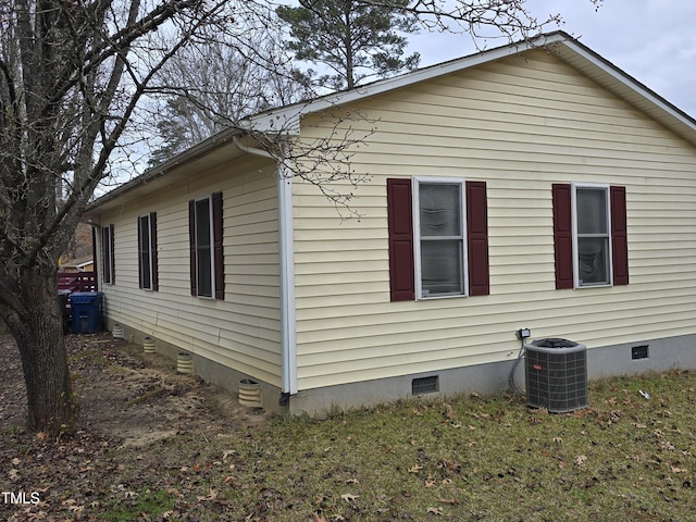 view of side of property with central AC