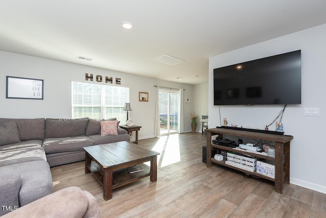 living room with light hardwood / wood-style floors