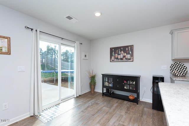 interior space with hardwood / wood-style flooring