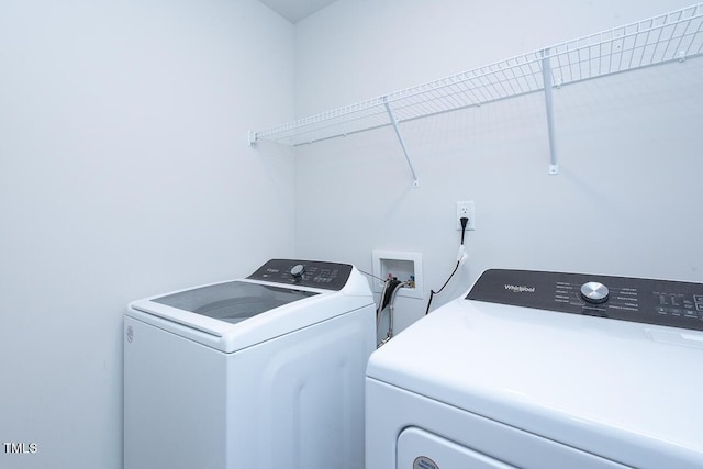 washroom featuring washer and dryer