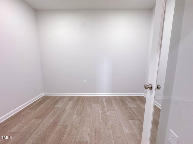 spare room featuring light wood-type flooring