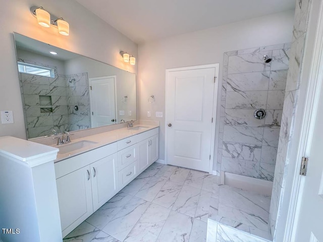 bathroom with tiled shower and vanity