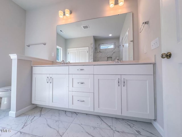 bathroom with a shower and vanity