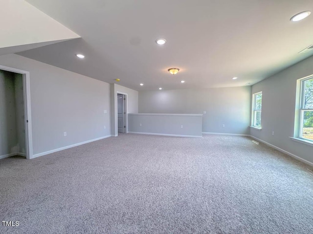 spare room with light carpet