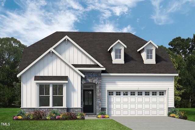 view of front of house featuring a garage and a front lawn