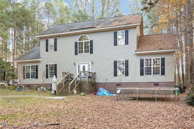 colonial house featuring a trampoline