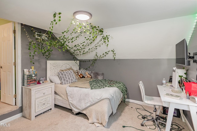 bedroom featuring light carpet