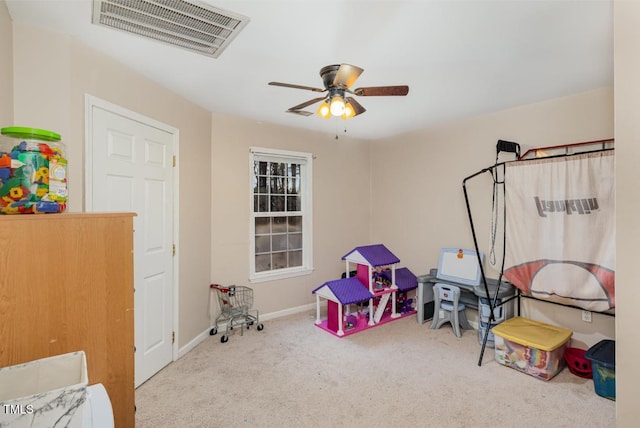 rec room featuring light carpet and ceiling fan