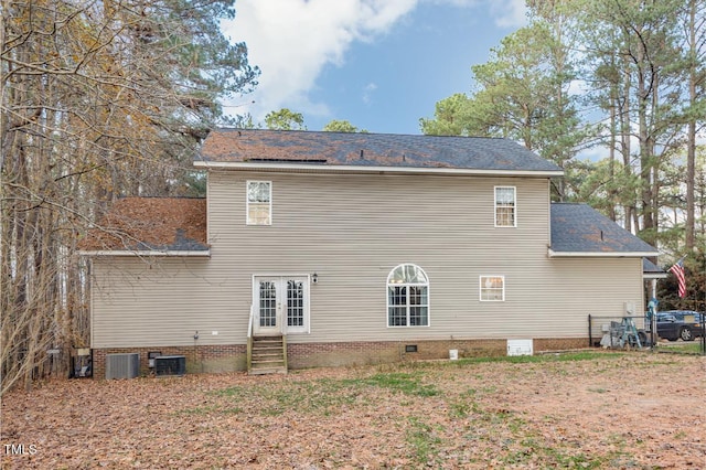 rear view of property with cooling unit