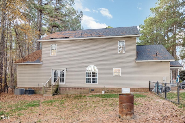 back of house featuring central AC