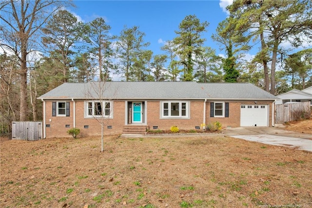 ranch-style house with a garage and a front lawn