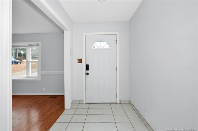 tiled entryway featuring plenty of natural light