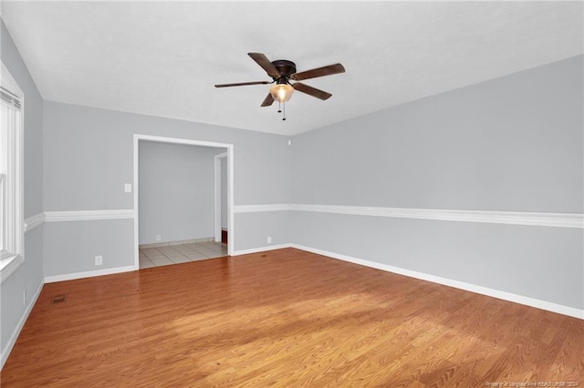 unfurnished room featuring light hardwood / wood-style floors and ceiling fan
