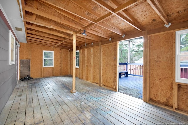 miscellaneous room featuring hardwood / wood-style floors and a wealth of natural light