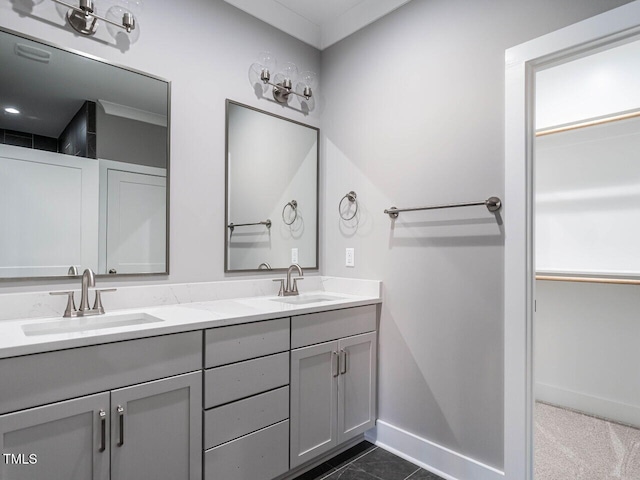 bathroom with tile patterned flooring, vanity, and ornamental molding