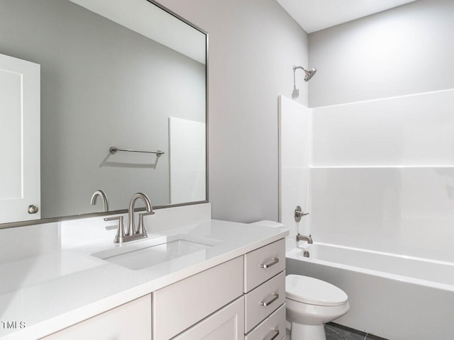 full bathroom featuring vanity, bathtub / shower combination, and toilet