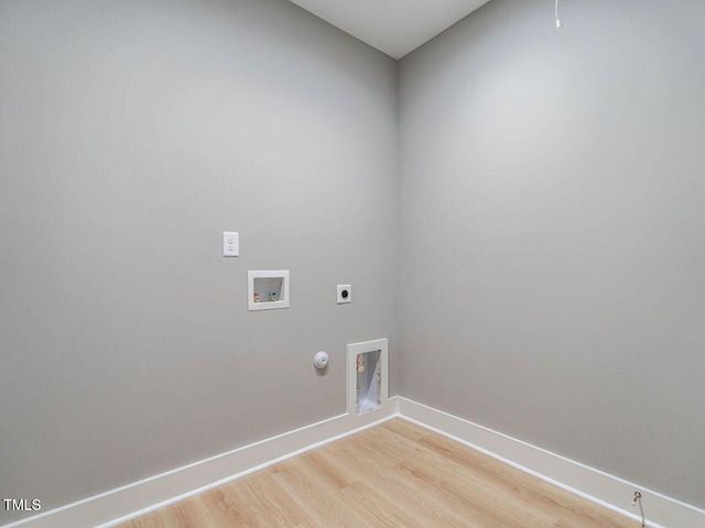 laundry area with hookup for an electric dryer, gas dryer hookup, light wood-type flooring, and washer hookup