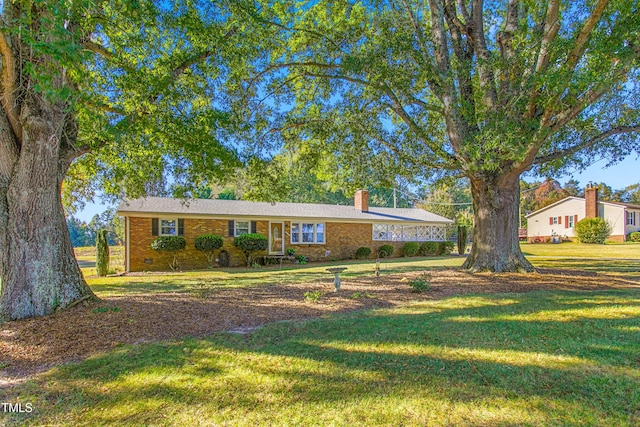 ranch-style house with a front yard