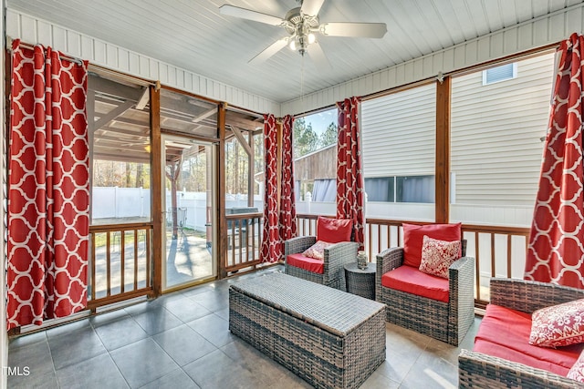 sunroom featuring ceiling fan