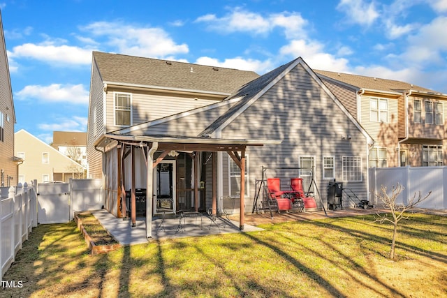 back of property featuring a yard and a patio area