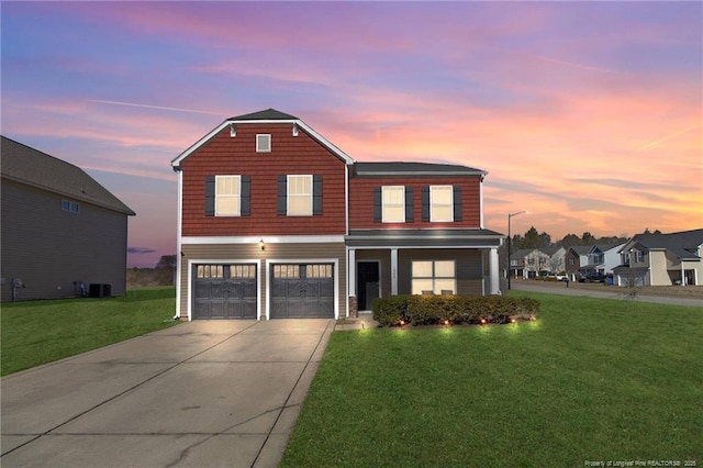 front of property with central AC, a garage, and a lawn