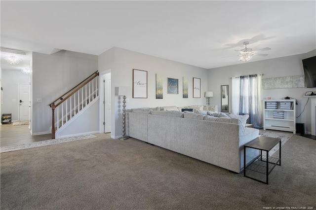 living room with carpet floors and ceiling fan