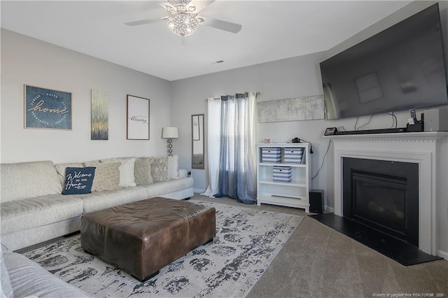 living room featuring carpet and ceiling fan