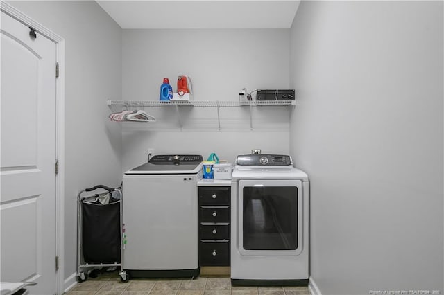 washroom with washer and dryer