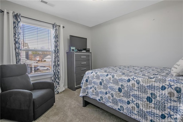 bedroom with light carpet