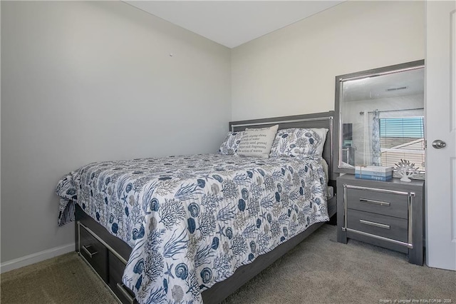 bedroom with dark colored carpet