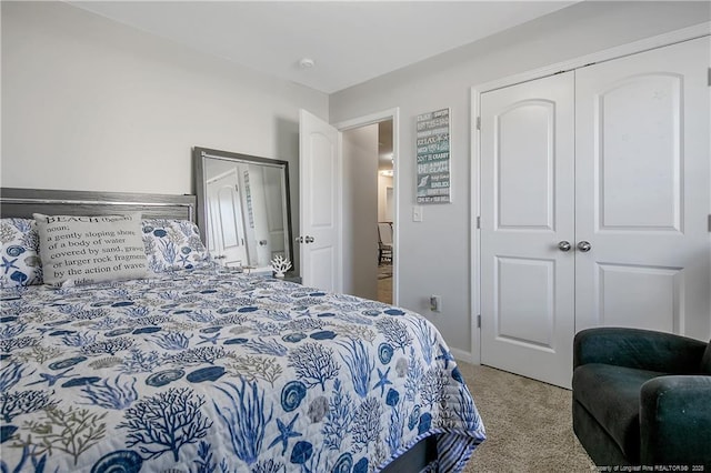 bedroom with light carpet and a closet