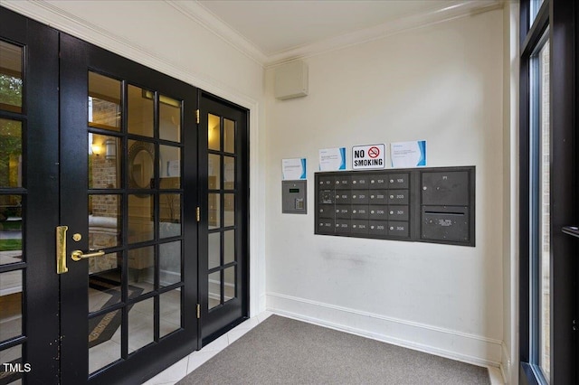 doorway to outside with carpet flooring, mail boxes, crown molding, and french doors