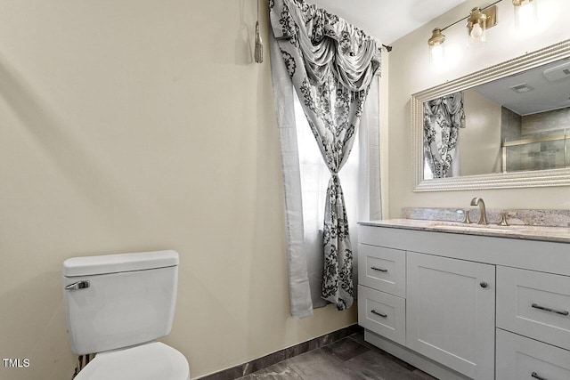 bathroom featuring a shower with curtain, vanity, toilet, and tile patterned flooring