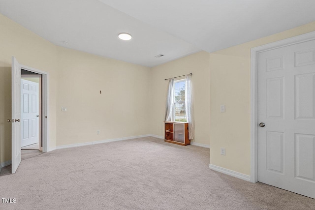 unfurnished bedroom with light colored carpet